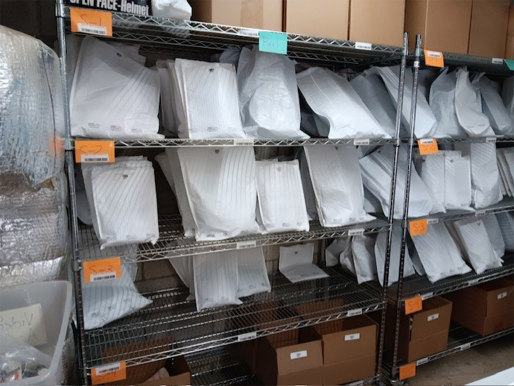 Packaged orders on shelf in e-commerce warehouse