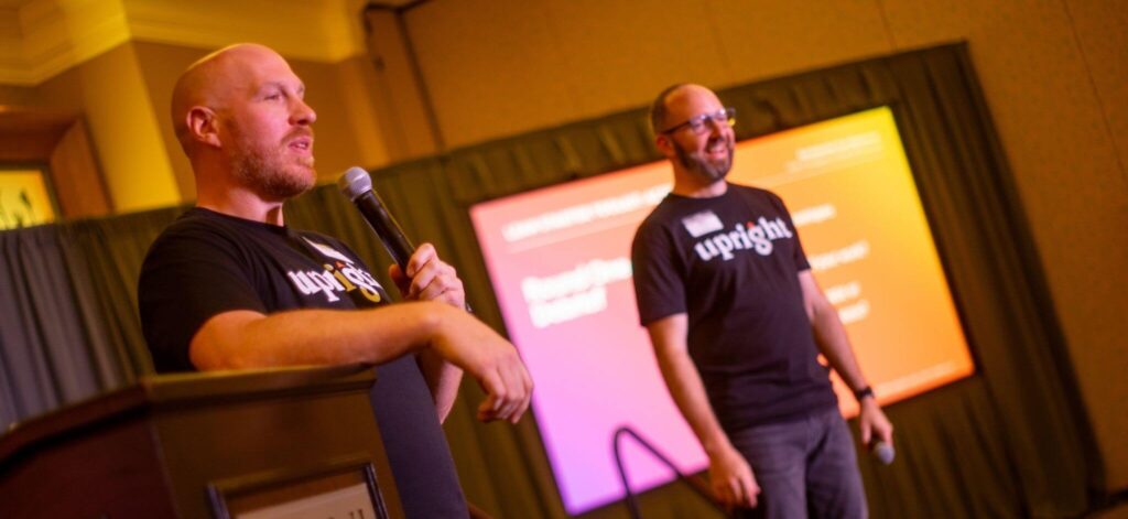 Upright Labs employees speaking about e-commerce solutions at conference