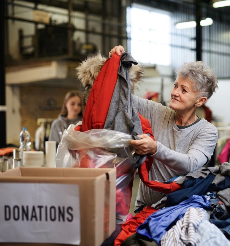 volunteer sorting donations at intake