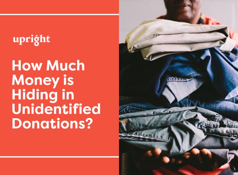 Upright banner: How Much Money Is Hiding in Unidentified Donations?, next to a person holding a stack of folded donated clothing
